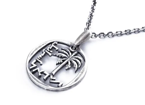 תליון עץ תמר חתוך ממטבע   10 אגורות, שנות ה 60